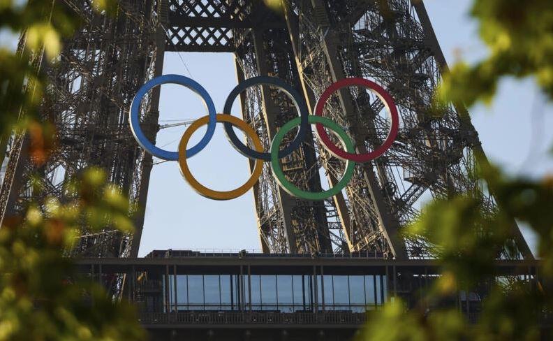 Olympic rings mounted on Eiffel Tower with 50 days to go until Paris Games