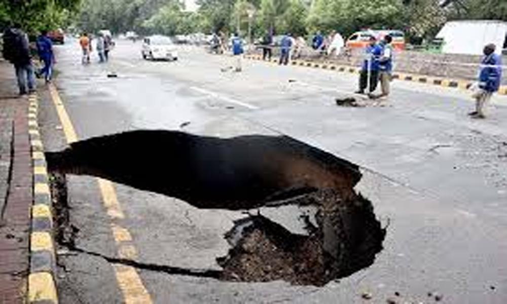 Crack on Lahore main road, car, two bikes fall