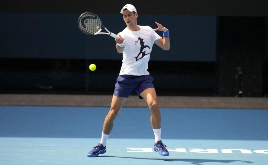 Djokovic warms up for Australian Open amid  deportation threat