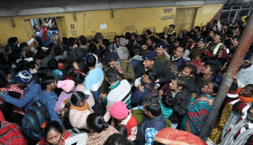 At least 18 dead in stampede at New Delhi railway station amid Kumbh Mela rush