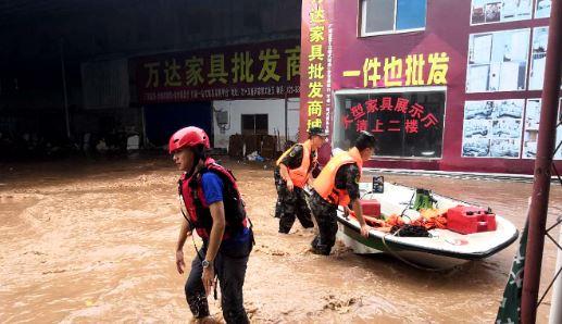 Climate-linked rains overwhelm northern China, kill 13