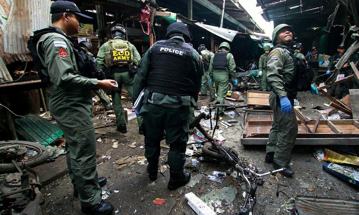 Southern Thailand town rocked by 13 bomb blasts; police kill two during raid