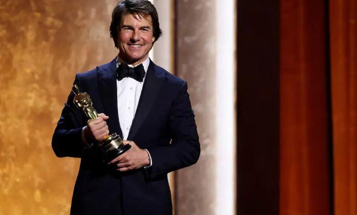 Tom Cruise touts the power of cinema as he accepts honorary Oscar