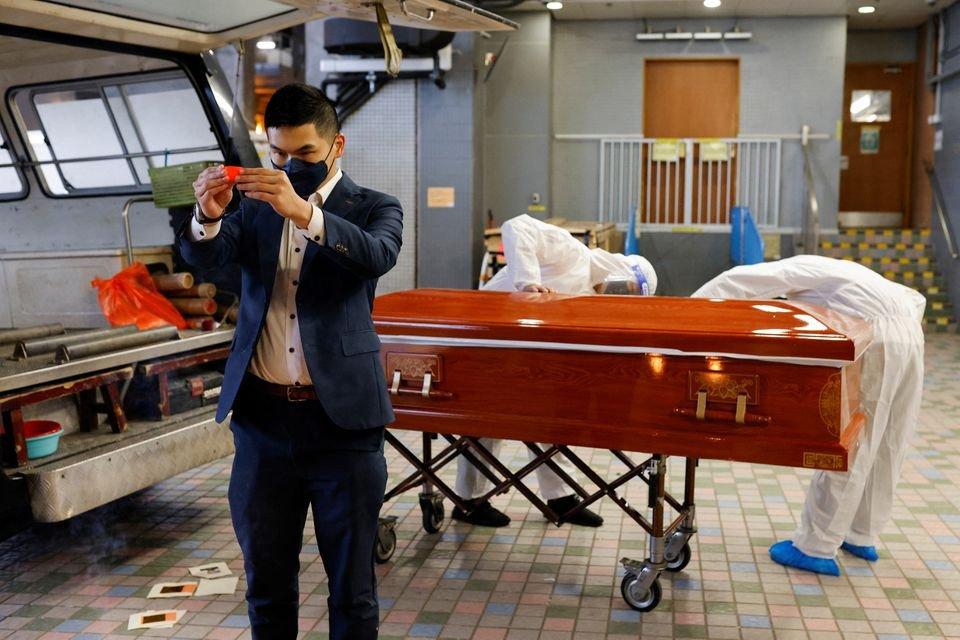 'So many bodies piled up': Hong Kong funeral services overwhelmed by COVID