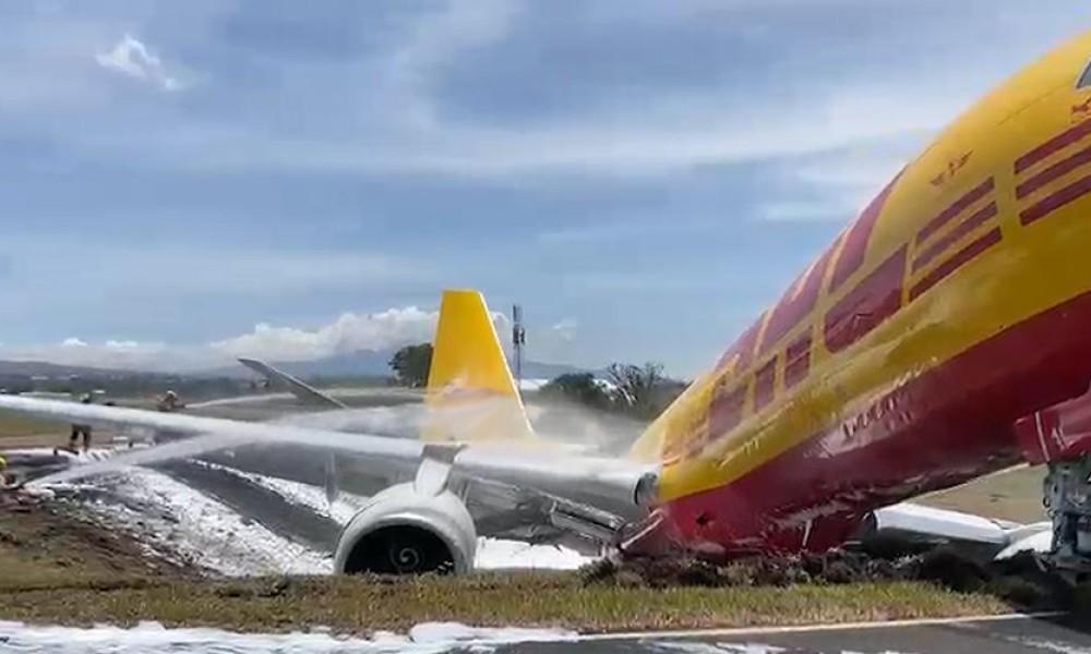 Cargo plane skids off runway, splits in half