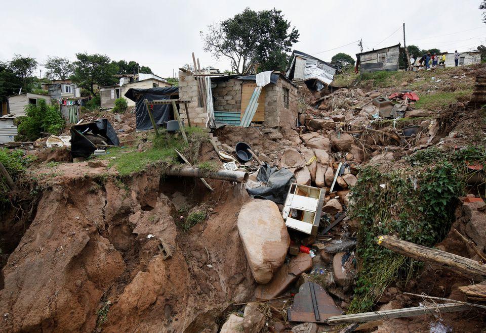 South African flood victims search for bodies of lost loved ones