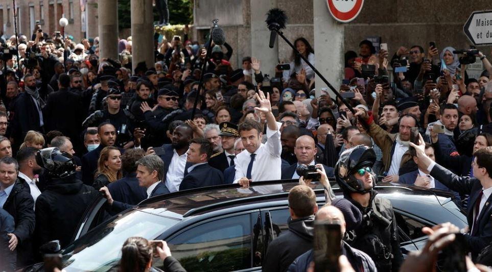 French President pelted by tomatoes in post-election walkabout 