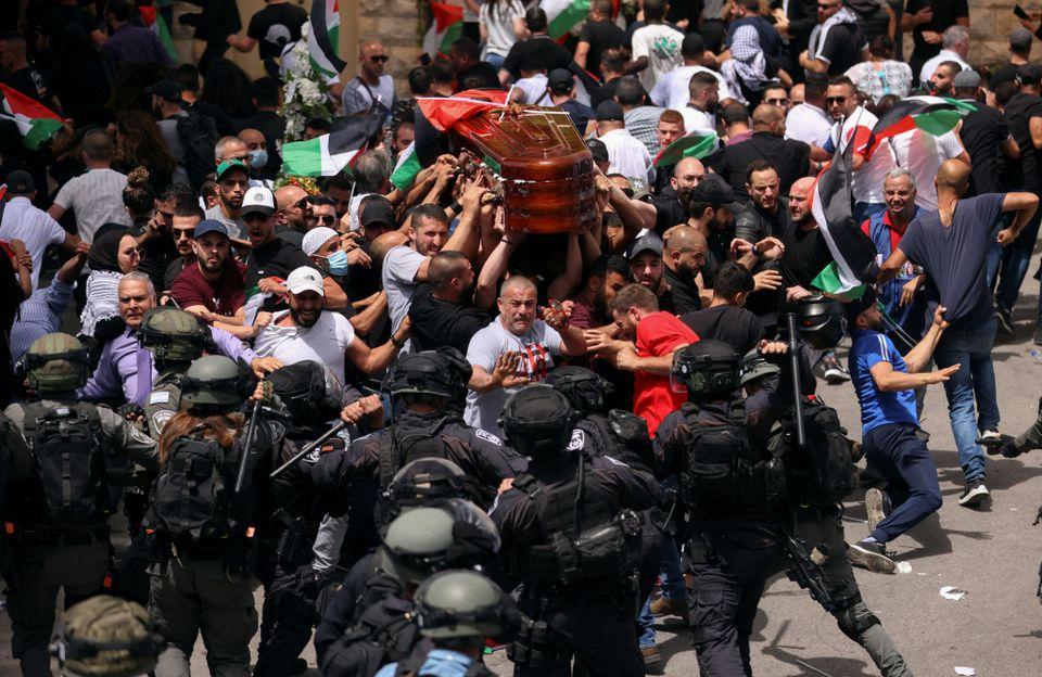 Israeli police beat pallbearers at Al Jazeera journalist’s funeral