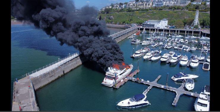 Superyacht catches fire in British marina