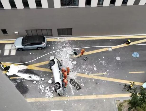 Chinese electric car falls from third-floor parking lot; kills two