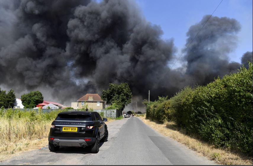 Huge fires engulf homes near London as temperatures hit record 40C