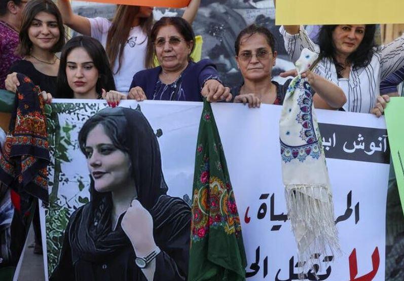 Iran's Revolutionary Guards issue warning amid spread in nationwide protests over woman's death