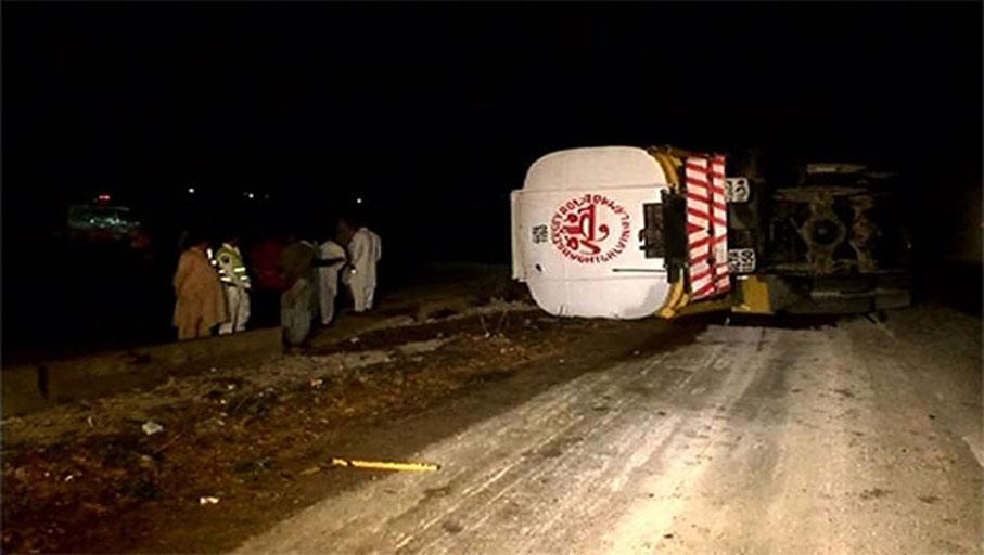 Rescuers remove oil tanker turned side down on Karachi's bridge