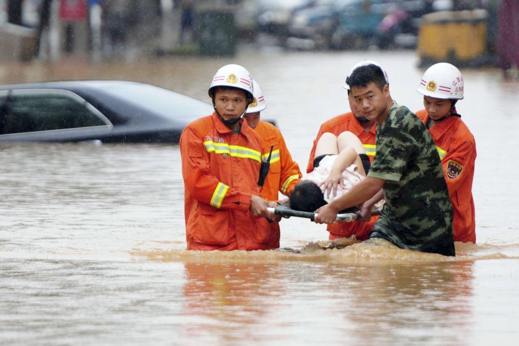 Thousands evacuated and coal mines shuttered as floods hit north China