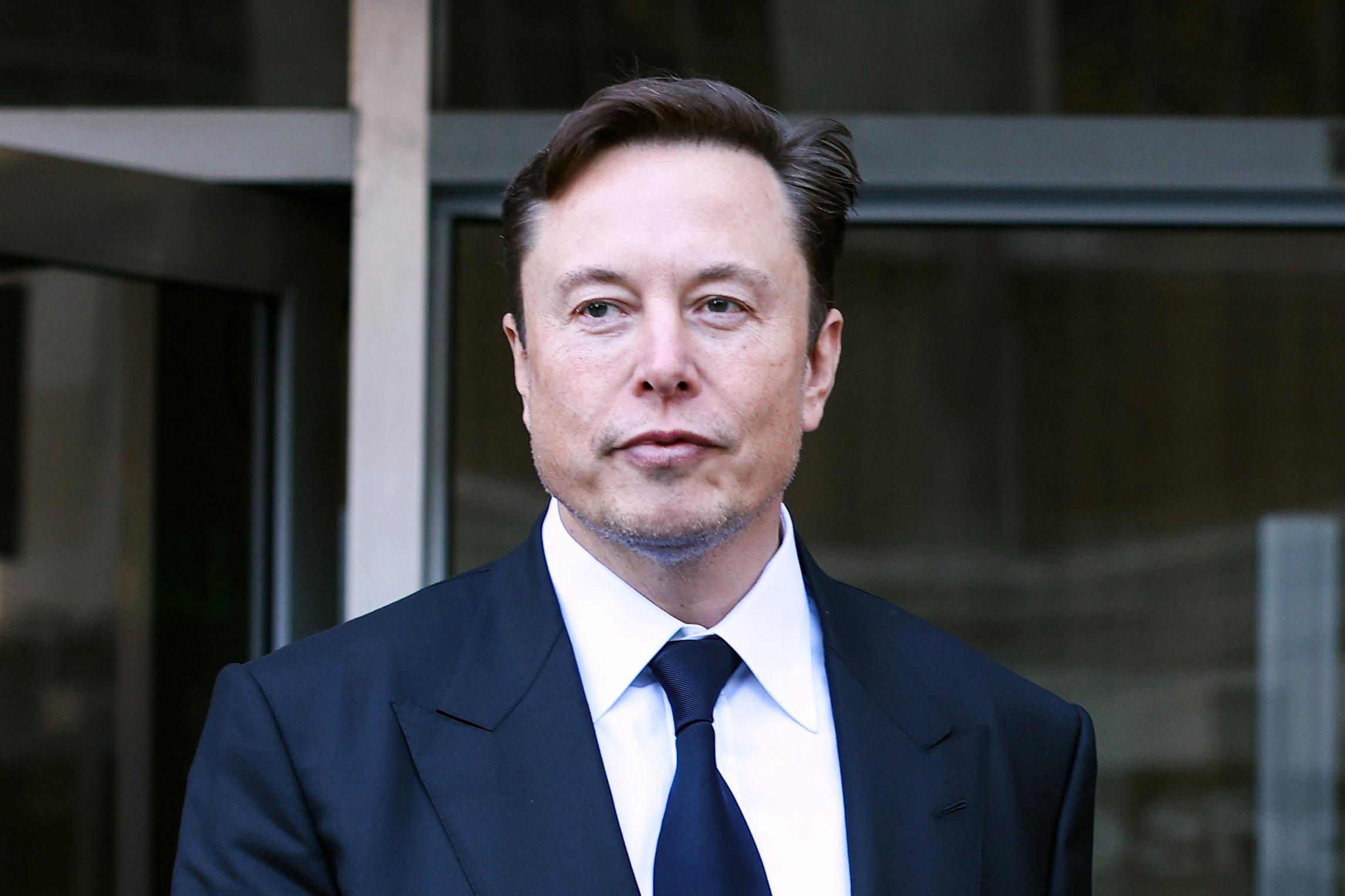 Elon Musk and others urge AI pause, citing 'risks to society'