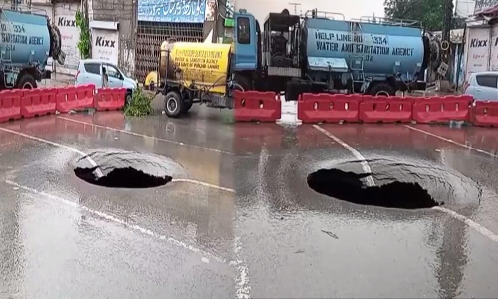 Huge sinkhole emerges on Peco Road Lahore after torrential rain