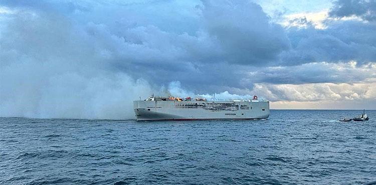 Ship carrying 3,000 cars burns, crew member dead