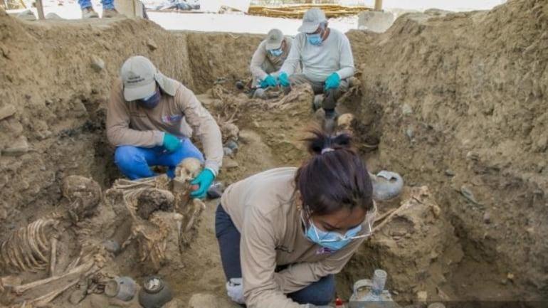 Archaeologists discover remains of 25 in Peru mass grave  