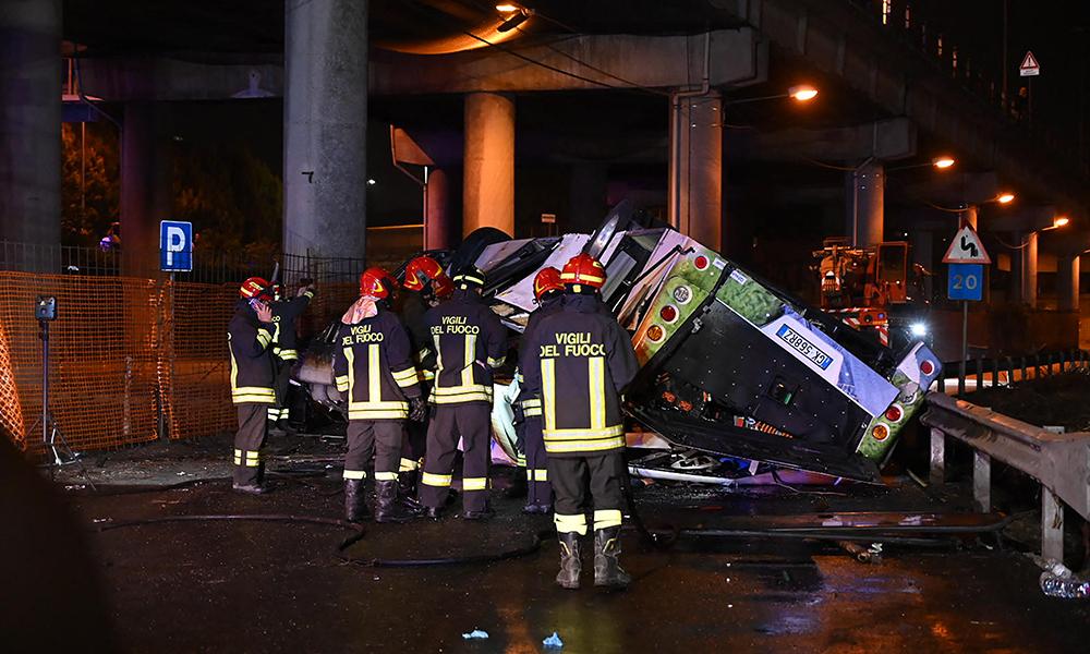 21 dead after Italian tourist bus plunges off Venice overpass