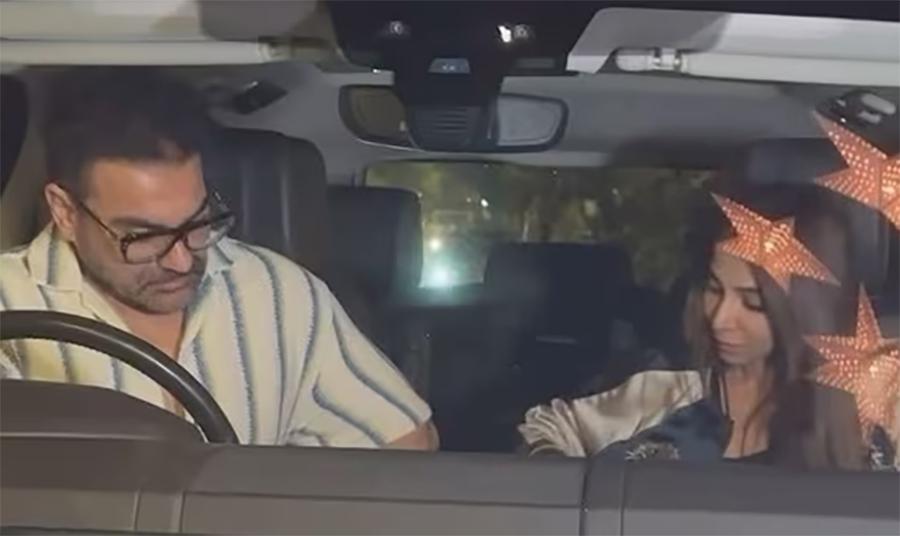 ارباز خان اہلیہ شورا خان کی  فوٹوگرافروں سے بچنے کی کوشش