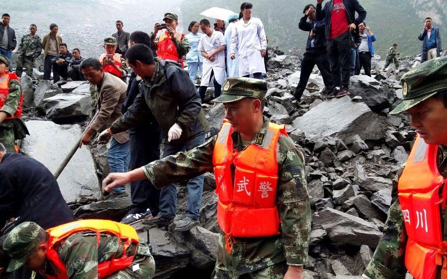 Landslides in China leave eight dead