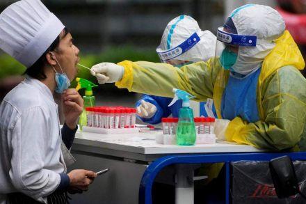 Shanghai hits prized 'zero COVID' status but lockdown lingers