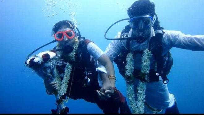 Taking the plunge: Indian couple ties knot underwater