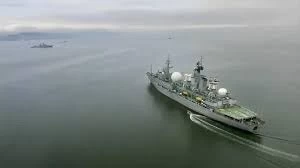 Russia says warning shots fired to force British warship away; UK denies it