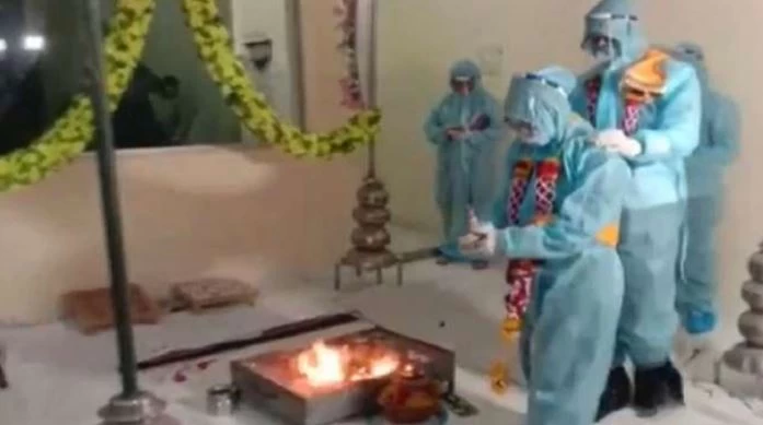 Indian couple marries in PPE kit after groom contracts coronavirus