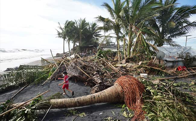 At least 12 dead as Philippines typhoon floods villages, uproots trees