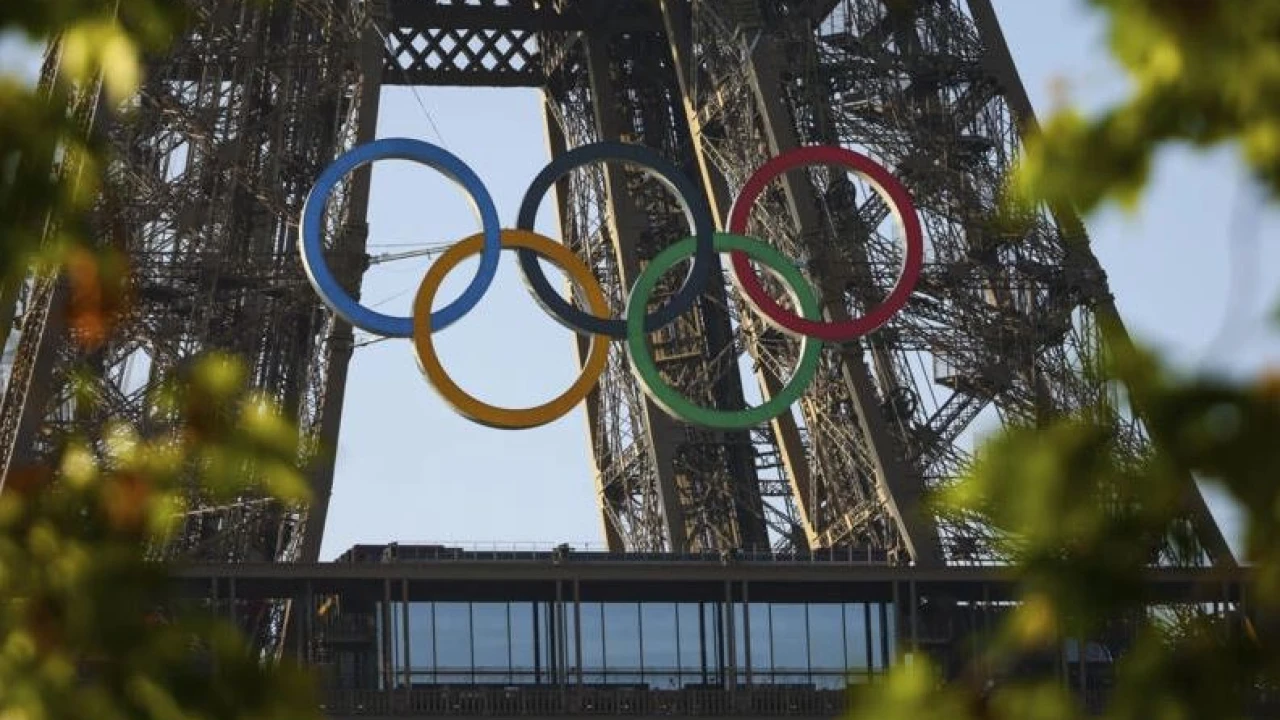 Olympic rings mounted on Eiffel Tower with 50 days to go until Paris Games