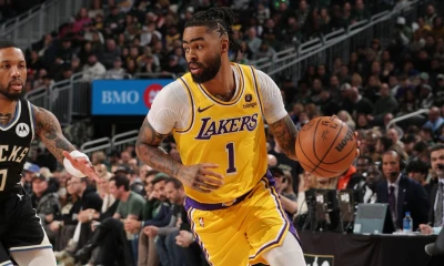 Russell says he intends to opt in, stay with Lakers