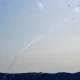 Hezbollah launches over 200 rockets, swarm of drones at 10 Israeli military sites