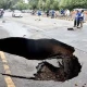 Crack on Lahore main road, car, two bikes fall