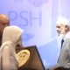 Dr Zakir Naik walks away from stage during an event in capital