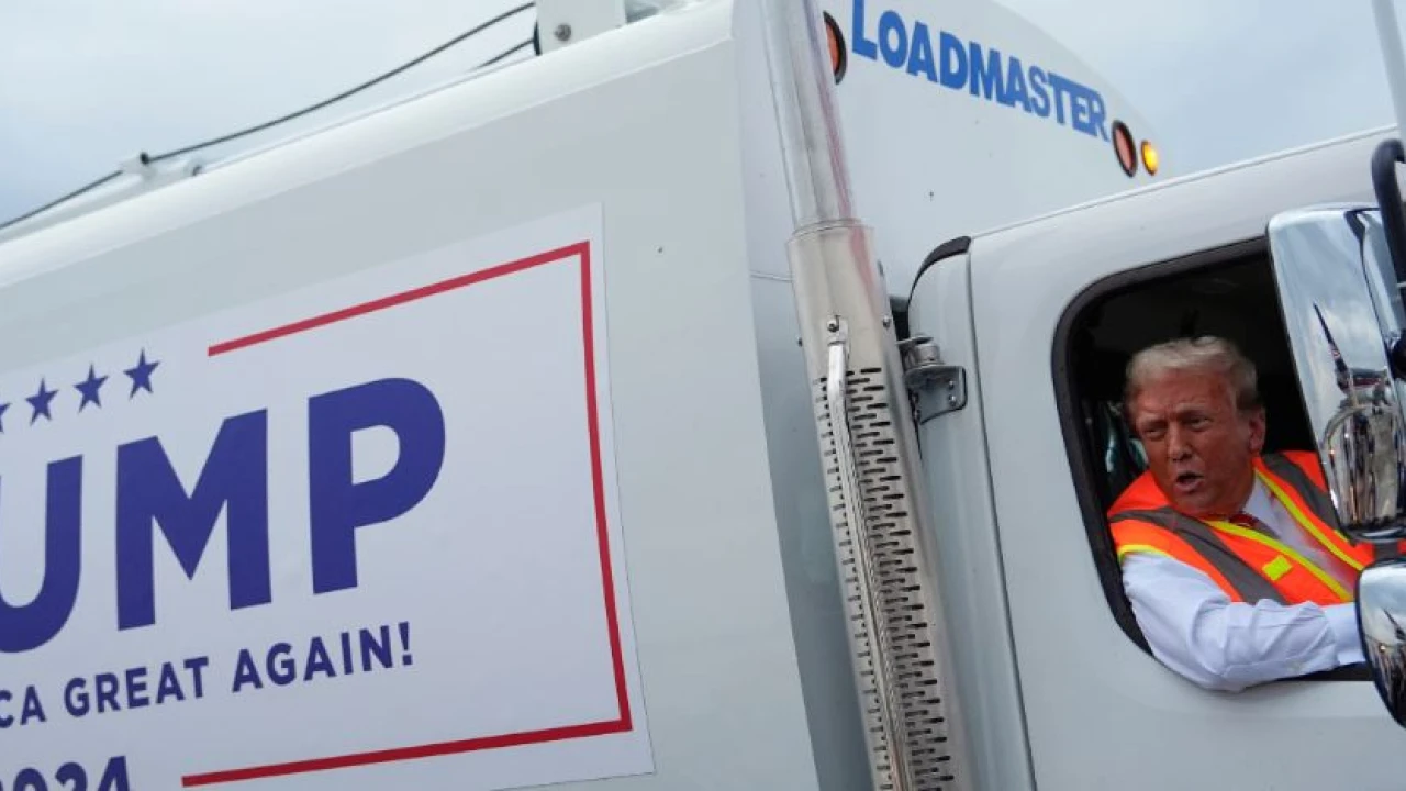 Donald Trump boards a garbage truck to draw attention to Biden remark