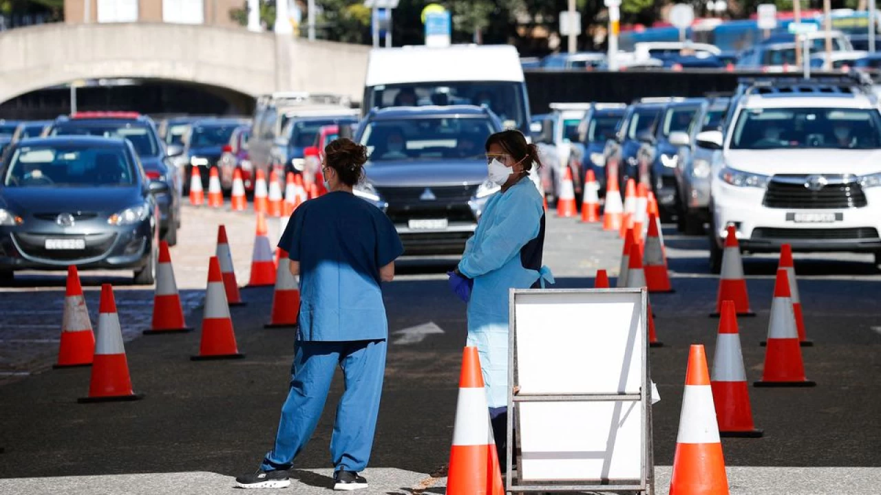 Australia treasurer tests positive for COVID-19 as daily cases soar past 100,000