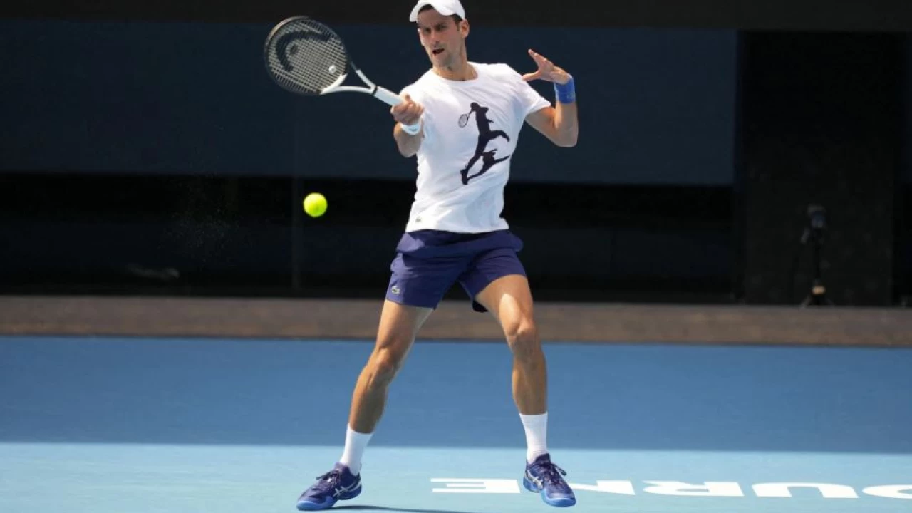 Djokovic warms up for Australian Open amid  deportation threat