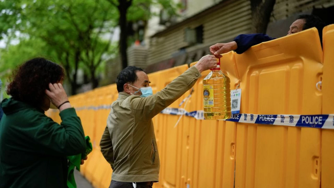 Shanghai vows punishment for COVID lockdown violators as cases hit 25,000