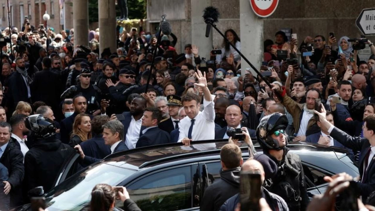 French President pelted by tomatoes in post-election walkabout 