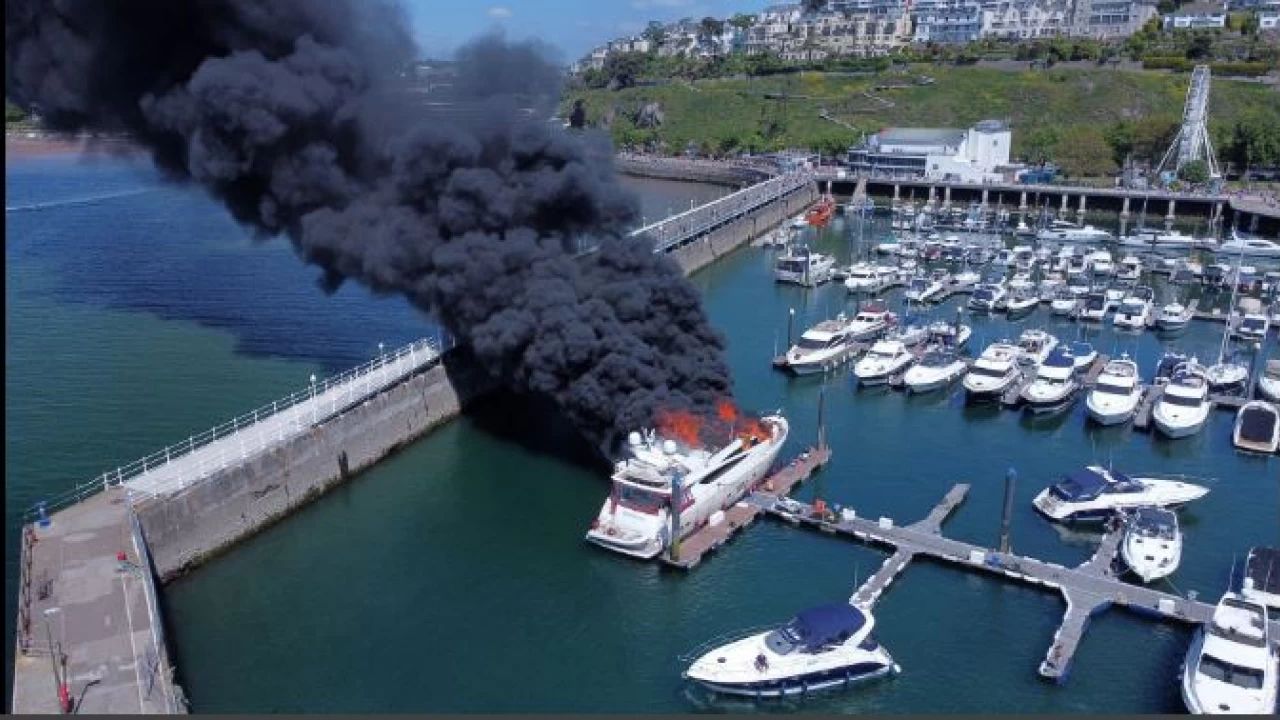 Superyacht catches fire in British marina