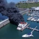 Superyacht catches fire in British marina