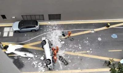 Chinese electric car falls from third-floor parking lot; kills two