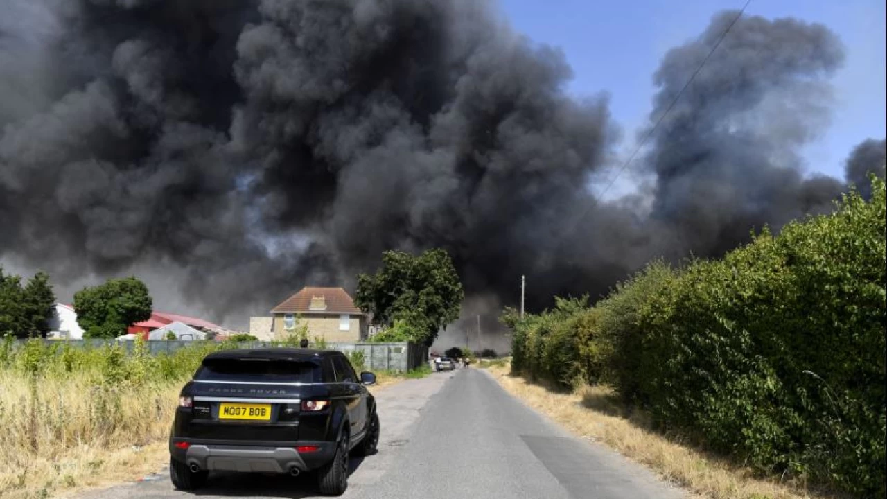 Huge fires engulf homes near London as temperatures hit record 40C