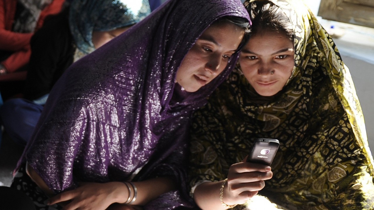 In photo : Afghan girls using phone