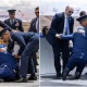 US President Biden falls on stage during ceremony