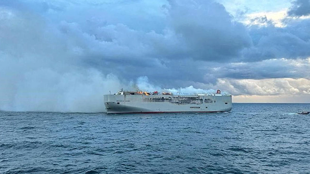 Ship carrying 3,000 cars burns, crew member dead