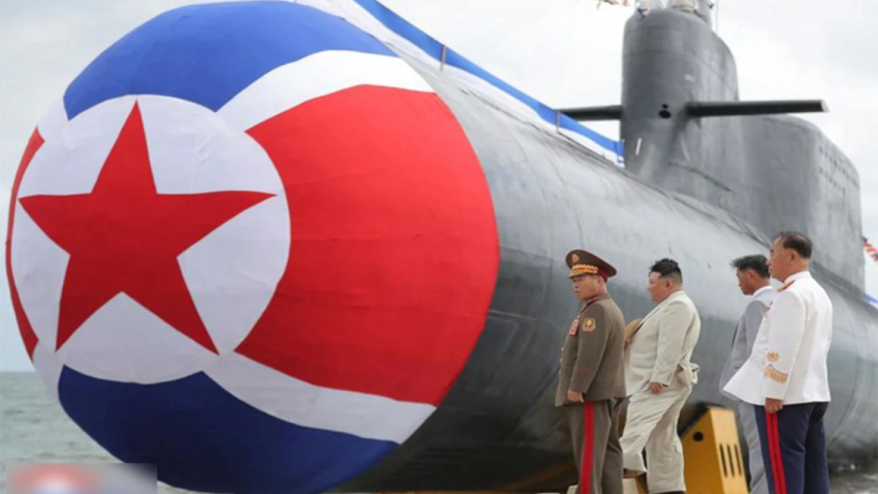 North Korea unveils nuclear-capable submarine