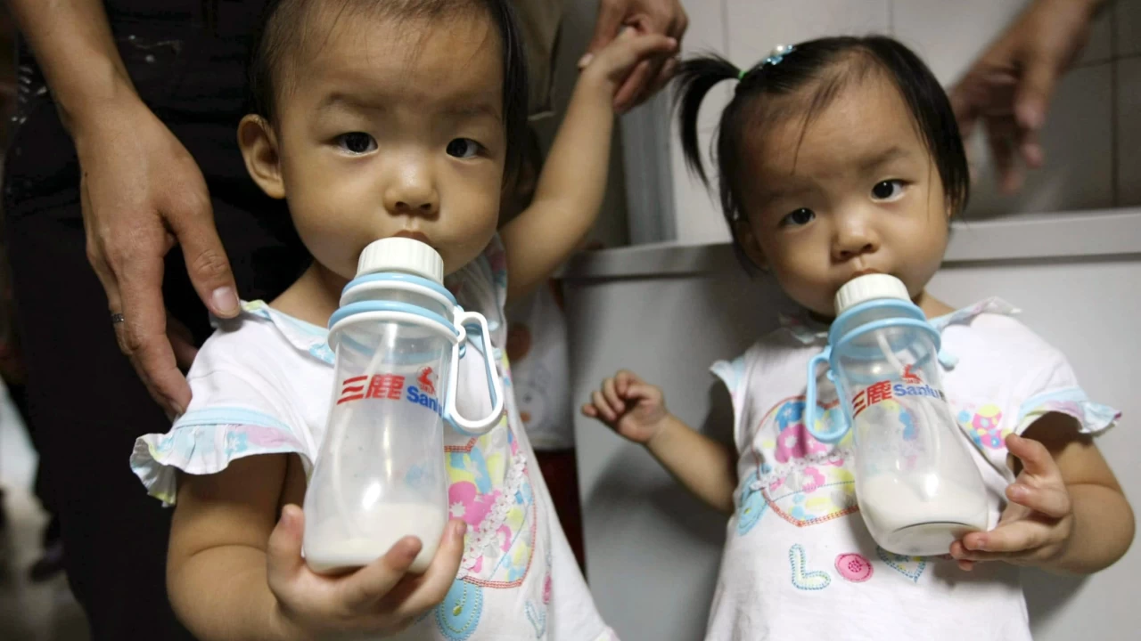 China formally passes three-child policy into law